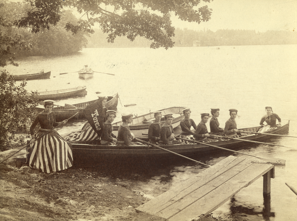 Crew Team and Shell on the Shore of Lake Waban