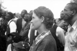 Myrtle Lawrence and others listen to a speaker at an outdoor STFU meeting