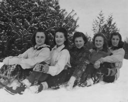 Female students pose in the snow