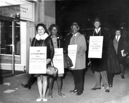 African American and Hispanic American workers on strike against Kellwood, wearing placards that encourage support for better wages