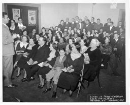Students fill the room for an ILGWU Local 144 class in trade unionism, January 1935.  The ILGWU resort at Unity House is advertised on the bulletin board.