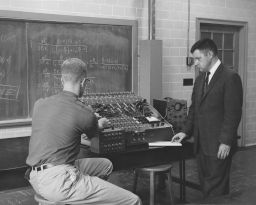 Physics Instructor and Student in Lab, Date Unknown