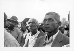Group of black men at an outdoor STFU meeting