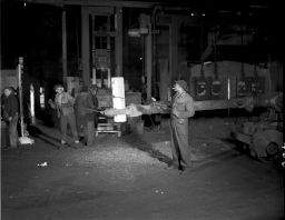 Midvale Company employees and 280mm artillery shell at the #16 press, February 13, 1953