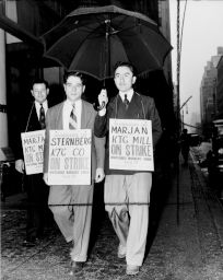 ILGWU Local 155 strikers Jack Wishnefsky and Max Kampelman picket in front of MarJan and Sternberg knitting mills, 134 West 36 St., New York.