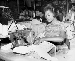 An ILGWU Local 105 woman sewing in a shop