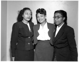 Maida Springer (Kemp) poses with two other African American women.