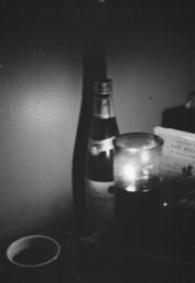 Wine bottle and candle, Michelangelo Apartments