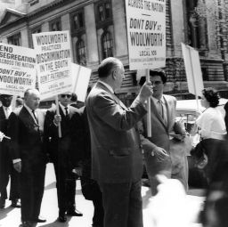 Members of the ILGWU Local 105 picket against Woolworth's segregation and discrimination policies, 1963. In sunglasses is Eddy Walinus, and on his left, Morris Bagno