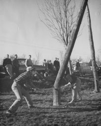 Felling a tree or wooden pole (woodsmen team?)