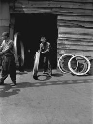 Midvale Company employees loading locomotive tires at tire wharf, May 31, 1949