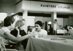 Three people drinking at the Raintree Lounge
