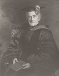 Ellen H. Richards in academic cap and gown, seated