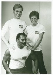 Three staff members in National Gay Task Force t-shirts