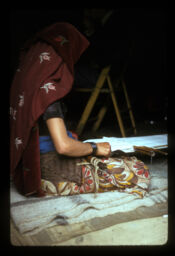 mahila doka thara bundai (महिला डोका थारा बुन्दै / Woman weaving thara)