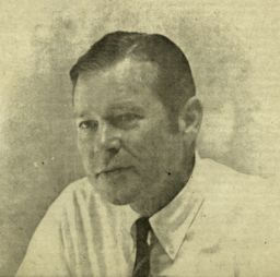 James B. Yarnall, director of OFISPA and assistant director of Office of International Programs, newspaper photograph