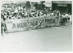 People with A Heritage of Pride banner at a gay pride march