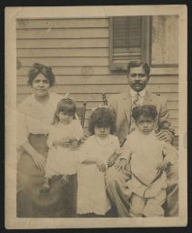Family portrait in front of house, New Bedford
