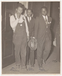 Jerome H. Holland and two others in front of Court