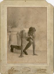 Alvin Christian Kraenzlein (1876-1928), D.D.S. 1900, studio portrait photograph, in ready position for a race