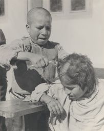 School children cutting eachothers hair