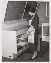 Barbara Kenrick removes silver- adjustable pullout trays