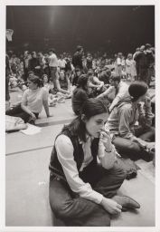 Girl sitting on the floor during the Barton Hall sit-in.