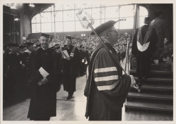 Cornell president James A. Perkins (left) in Barton Hall at Centennial celebration