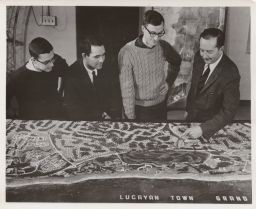 Frederick W. Edmondson and students with a model of Grand Bahama Island.