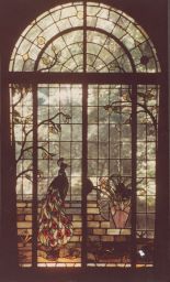 Interior view of the peacock stained glass window in Olive Tjaden's home.