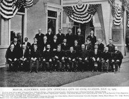 James Brister (1858-1916), D.D.S. 1881, in group portrait of city officials of Zion, Illinois, in 1903