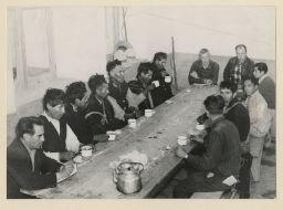 Vicosinos at long table, A. Holmberg at head