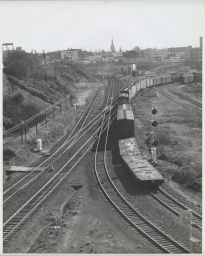 Train Heading Eastward Towards Steel Bridge