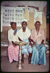 Householders relaxing before a betel tray