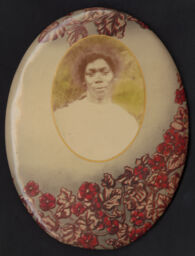 Portrait of a woman in an oval button frame