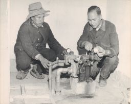 Technician teaching the use of a motor to a Vicos peasant