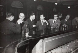 American businessmen at the bar of the American Club, Shanghai