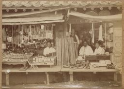 [Korean shopkeepers with wares]