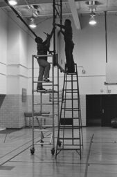Basketball backboard installation, South Bronx High School gym