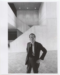 I.M. Pei posing in front of Johnson Art Museum stairs