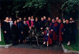 University Administration: Interim President Fagin, Interim Provost Lazerson, the deans of the University's twelve schools, and senior administrators pose with "Ben on the Bench" before the 1994 Commencement