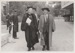 Sir Eric Ashby behind Cornell president James A. Perkins (left) and Adlai Ewing Stevenson II at Centennial celebration
