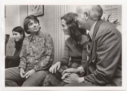 Daniel Berrigan smiling with others