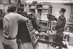 Lester F. Eastman in lab with two grad students