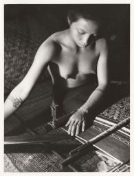 Woman close-up weaving