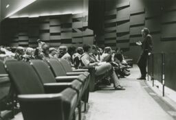 Ed Emshwiller speaking to an audience at fine arts symposium