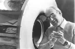 Britton Chance (born 1913), B.S. 1935, Ph.D. 1940, Sc.D. (hon.) 1985, with equipment related to his spectroscopy research