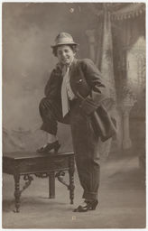 Male impersonator in suit and fedora