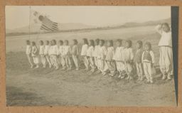 [Korean children with American and Korean flags]