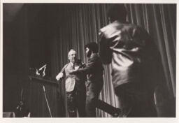 President Perkins being grabbed by Gary Patton at the Statler Auditorium